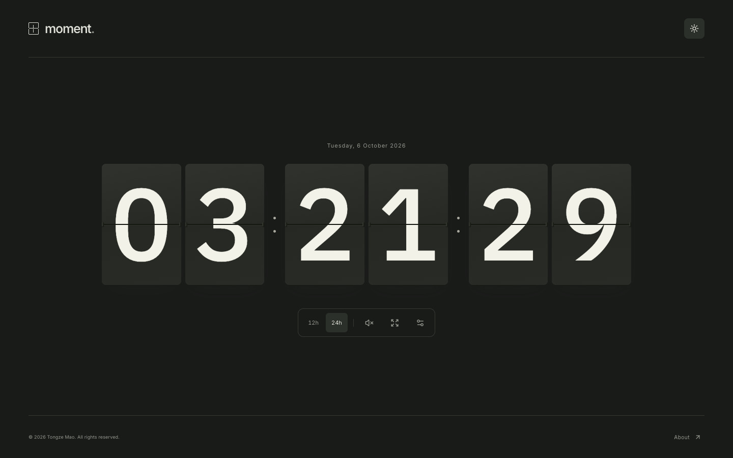 Moment’s flip clock with charcoal cards and ivory numerals in the dark theme